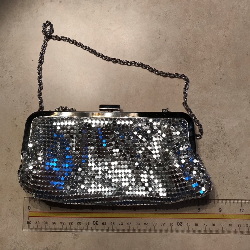 Silver clutch with small metal chain strap